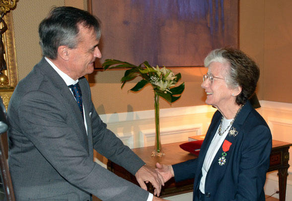 Dr. Rita Colwell accepting her 'Chevalier de la Legion d'Honneur' from the Ambassador of France, to the United States, Gerard Araud